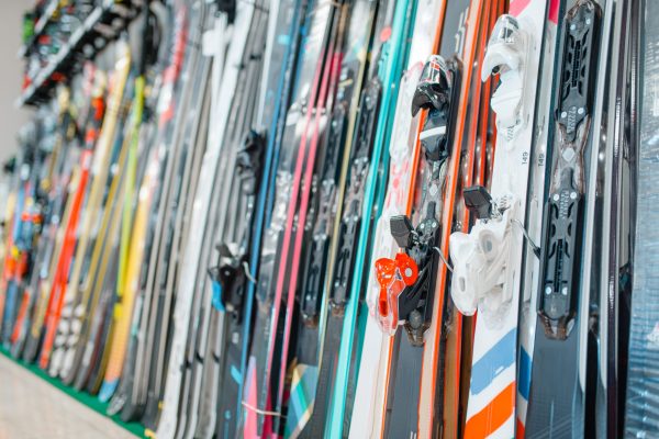 Rows of skis in sports shop, closeup, nobody Rows of skis in sports shop, closeup, nobody. Winter extreme, active leisure, showcase with equipment